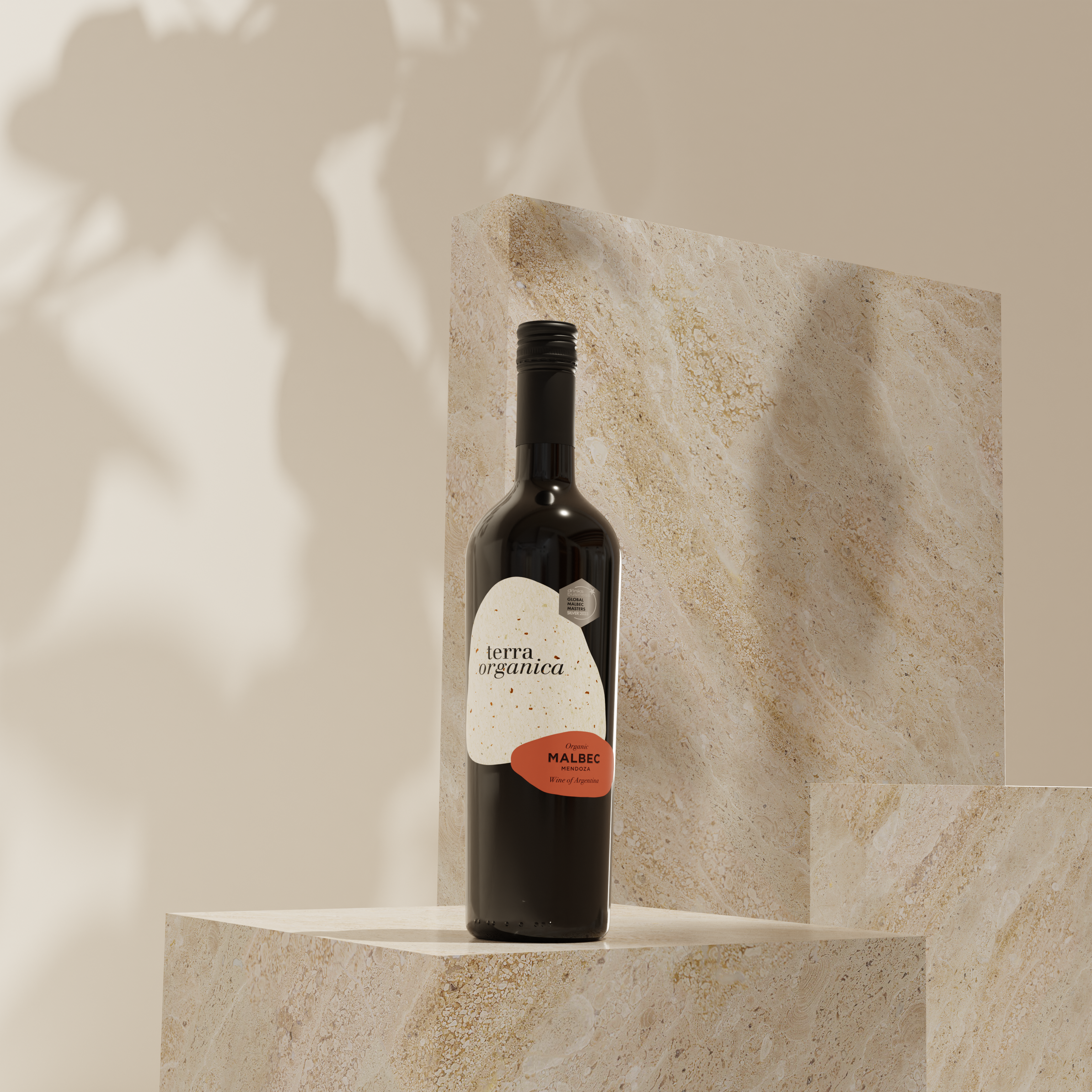 A bottle of terra organica's organic malbec wine on a rock